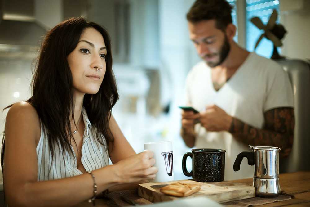 oung couple man using his mobile phone