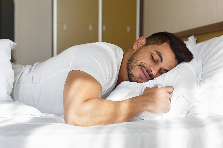  Man Sleeping on bed  