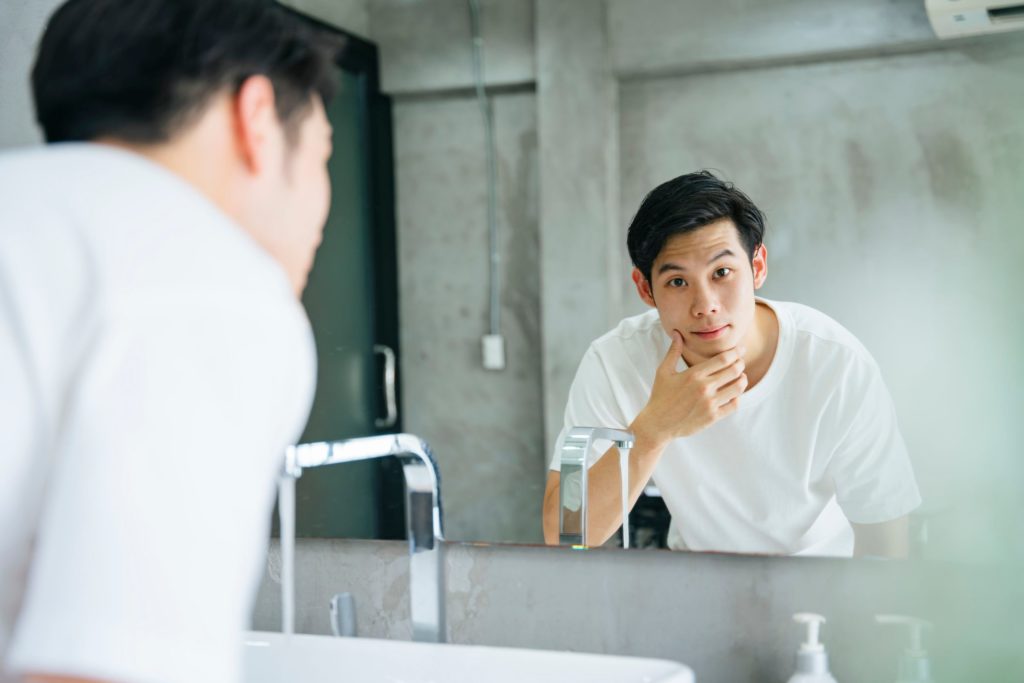 Man cleaning face 