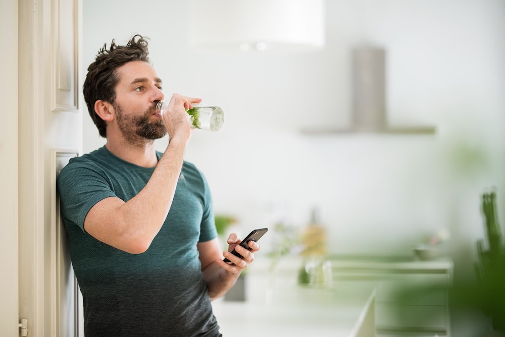 Young man drinking water 