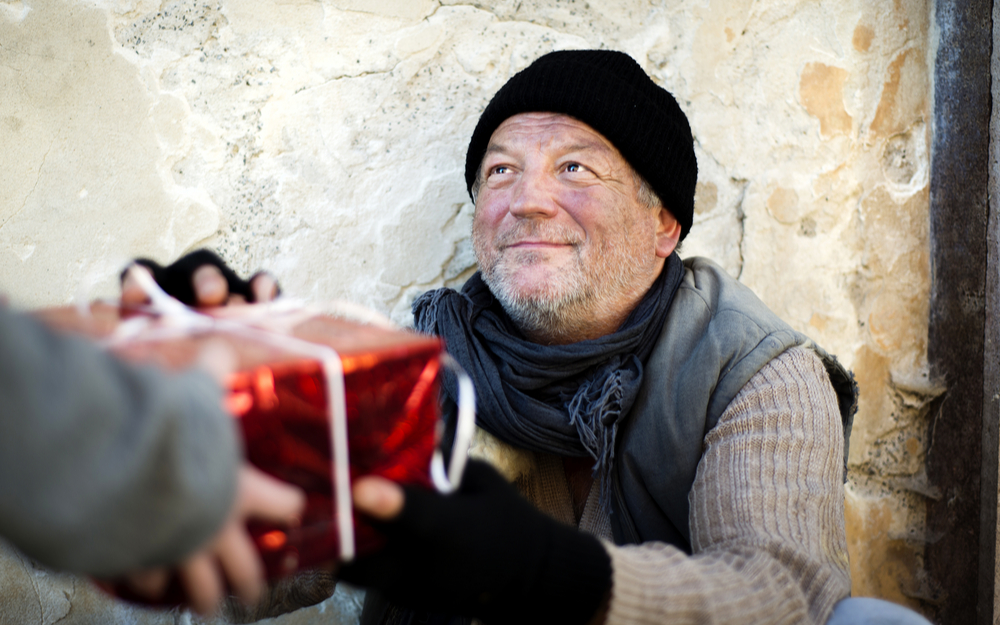 Charity Man Encouraging Other People Giving Food for Homeless