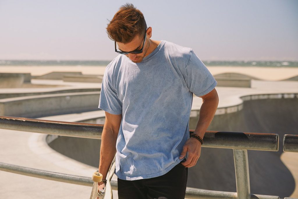 young man wearing sky blue T-Shirt