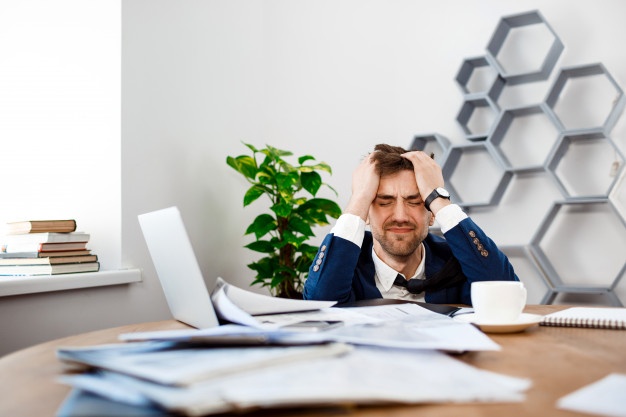 Failed businessman sad in office