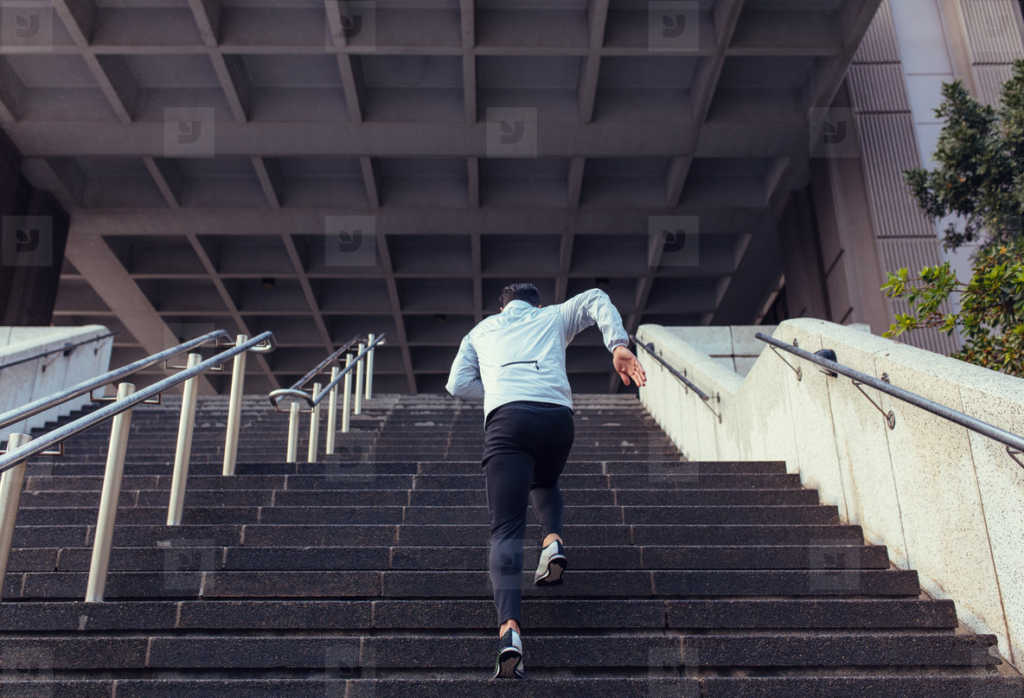 man running up the stairs