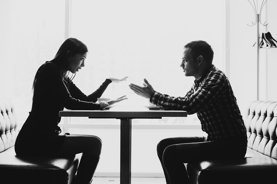 Man and woman in discussions in the restaurant