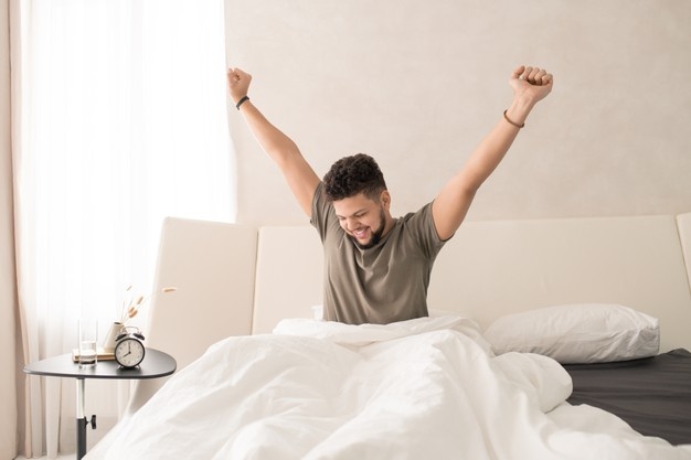 Young Beard Man On The Bed Awake 