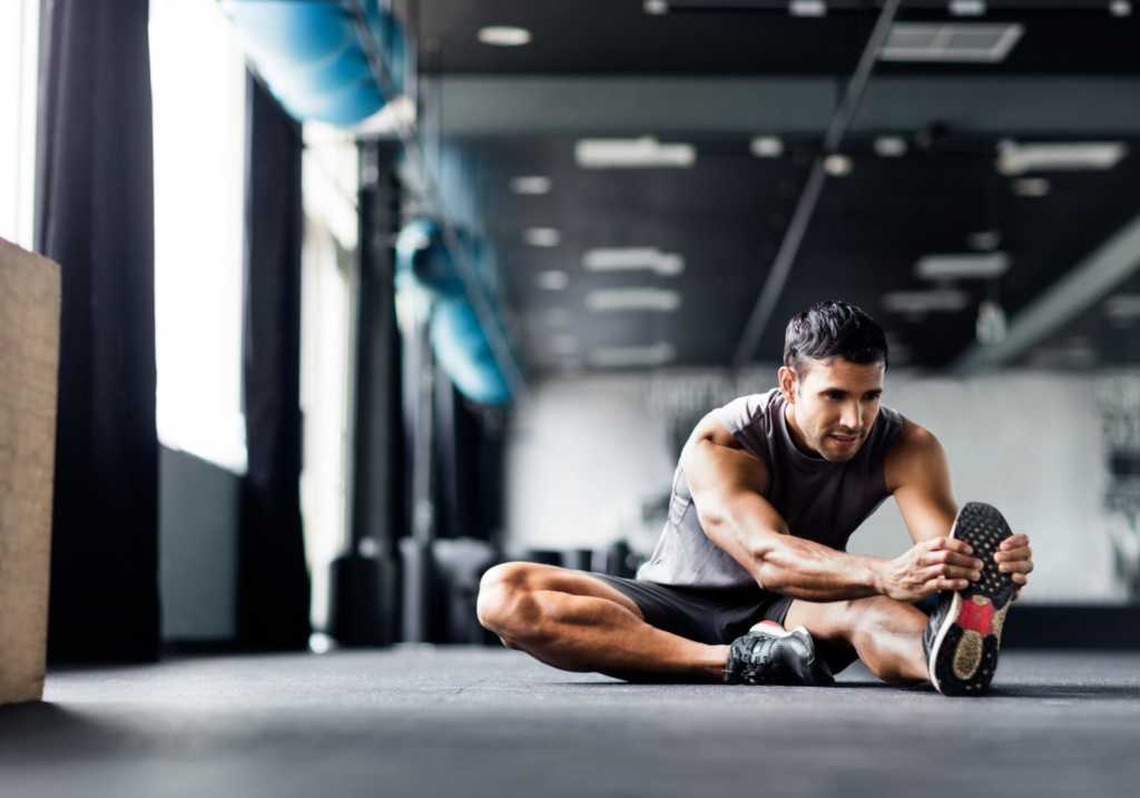 man Stretching Gym