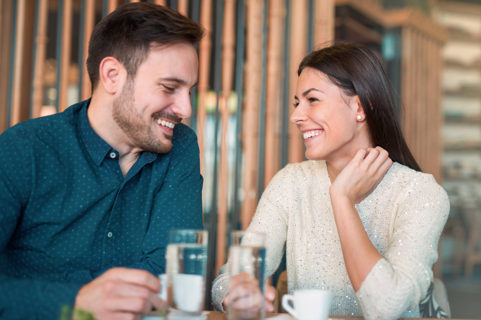 Handsome loving couple flirting in a cafe. Love and romance.