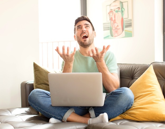 Man feeling stressed, worried, anxious or scared, with hands on head, panicking at mistake 