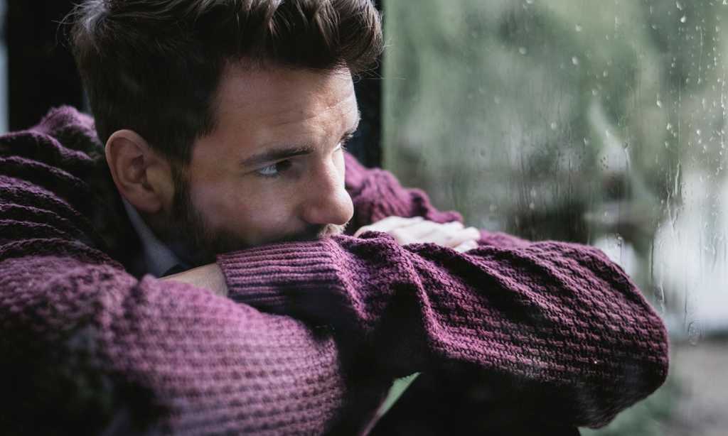 man sitting thinking