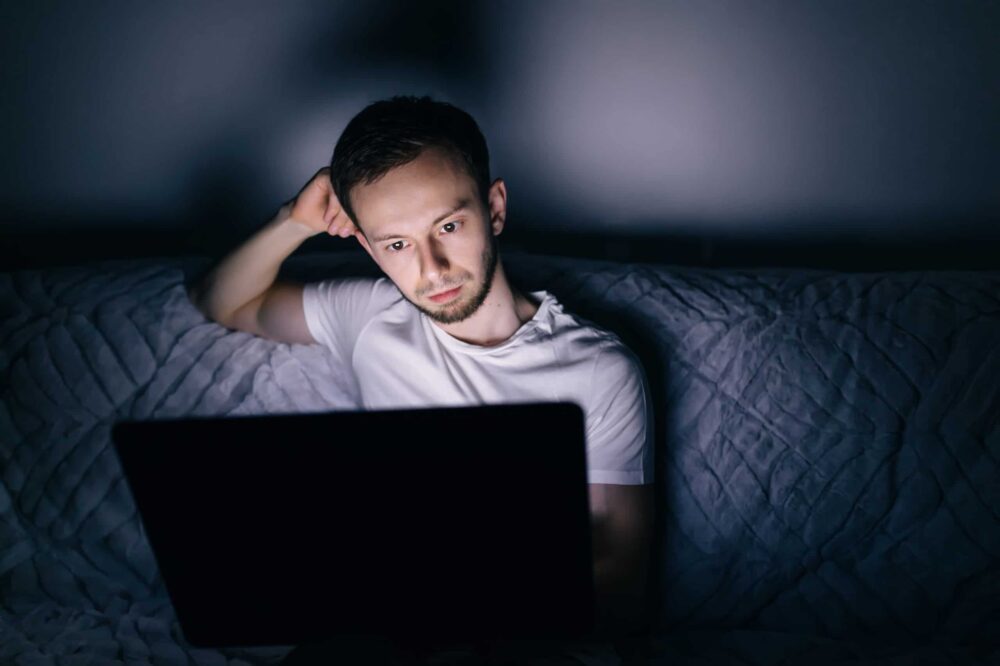  man watching at laptop