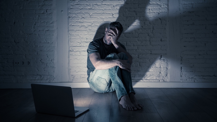 man watching at laptop