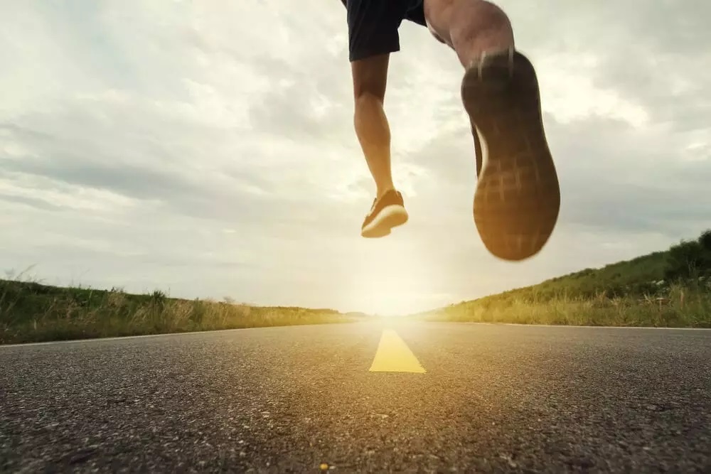 man jumping on the road 