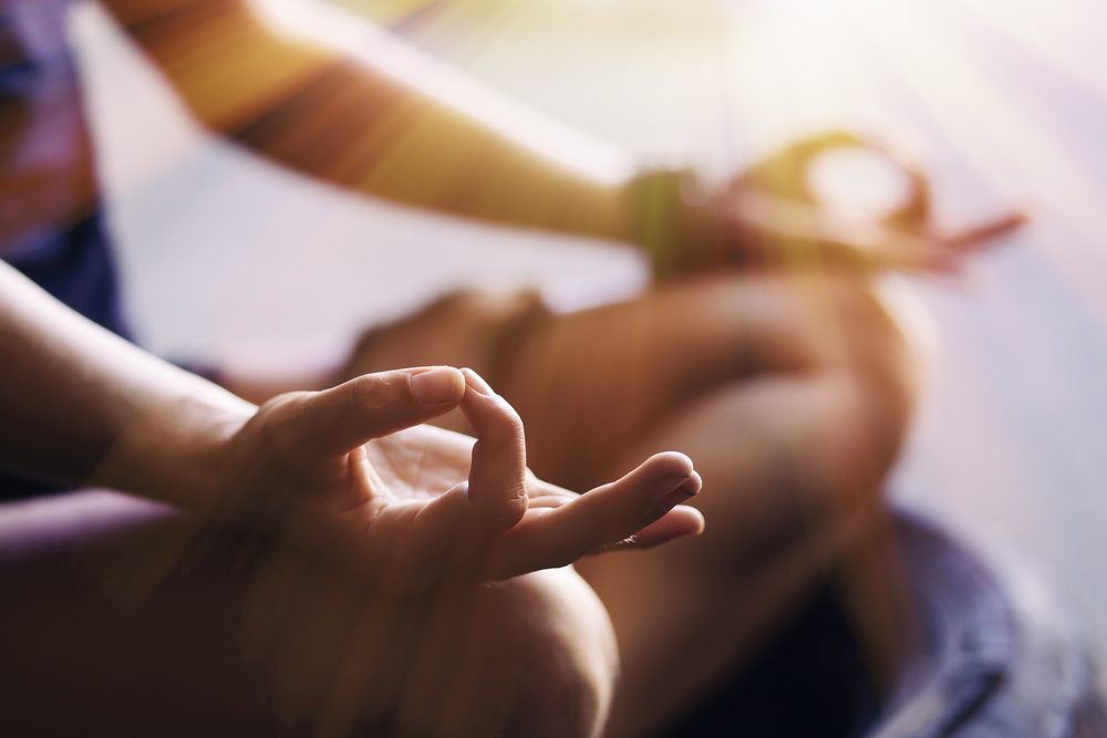 The Hand Of Young Man Doing Meditation 
