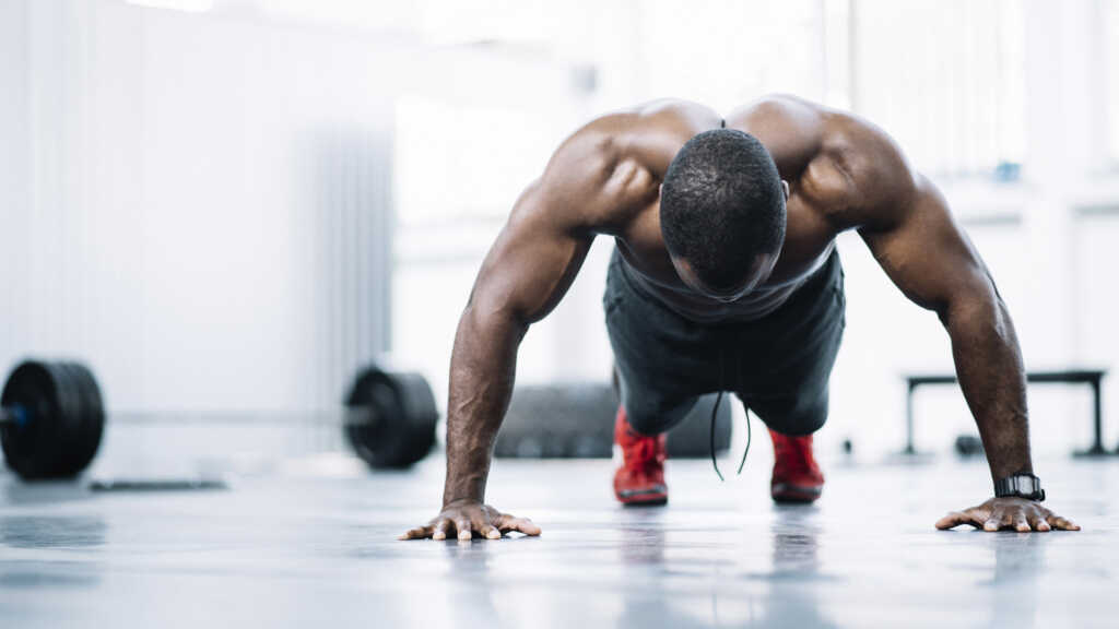 Strong black man doing pushups