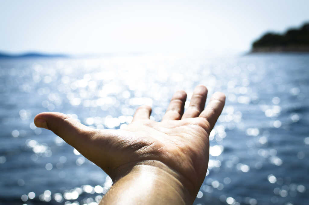 Man feeling freedom on open sea