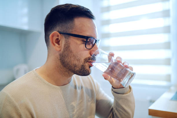 man drinks water