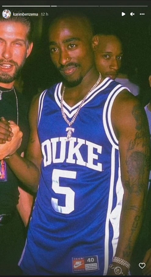 Tupac shaking hand with Baldwin
