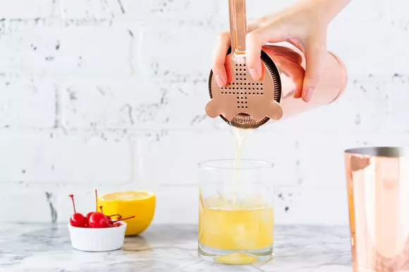 making cocktail from whiskey