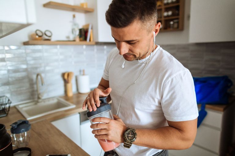 young-man-making-protein-shake