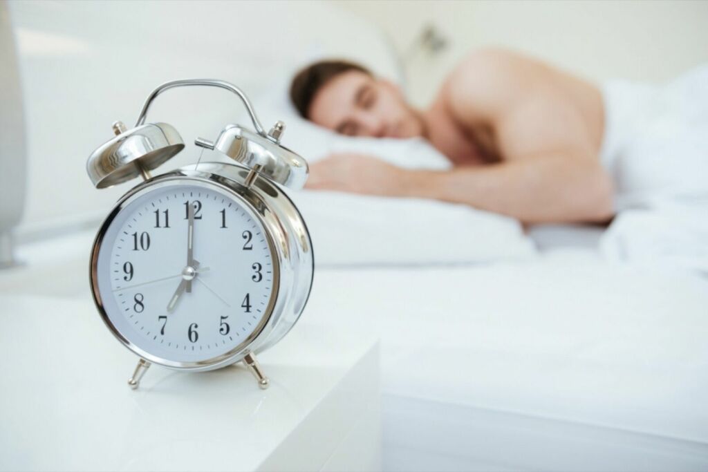 man sleeping in bed