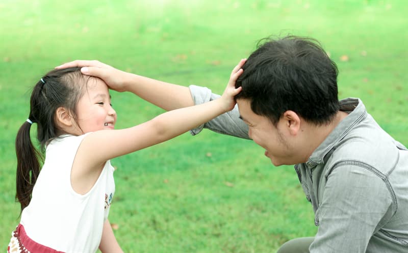 touching other people head