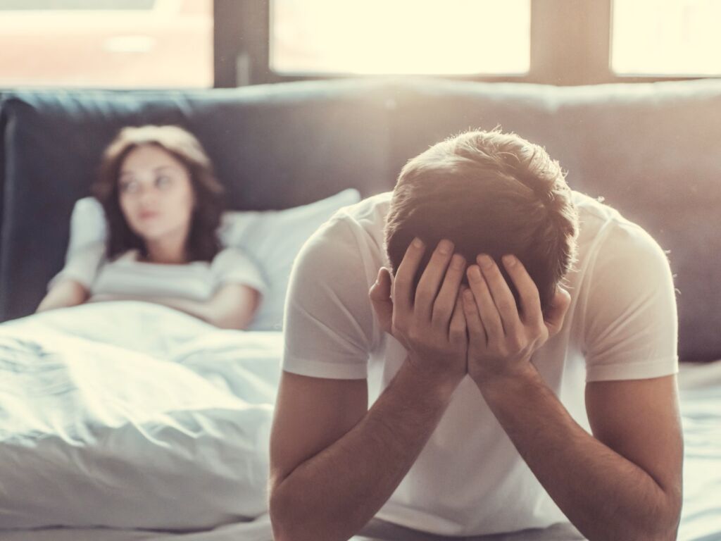 Woman and man in the bedroom 