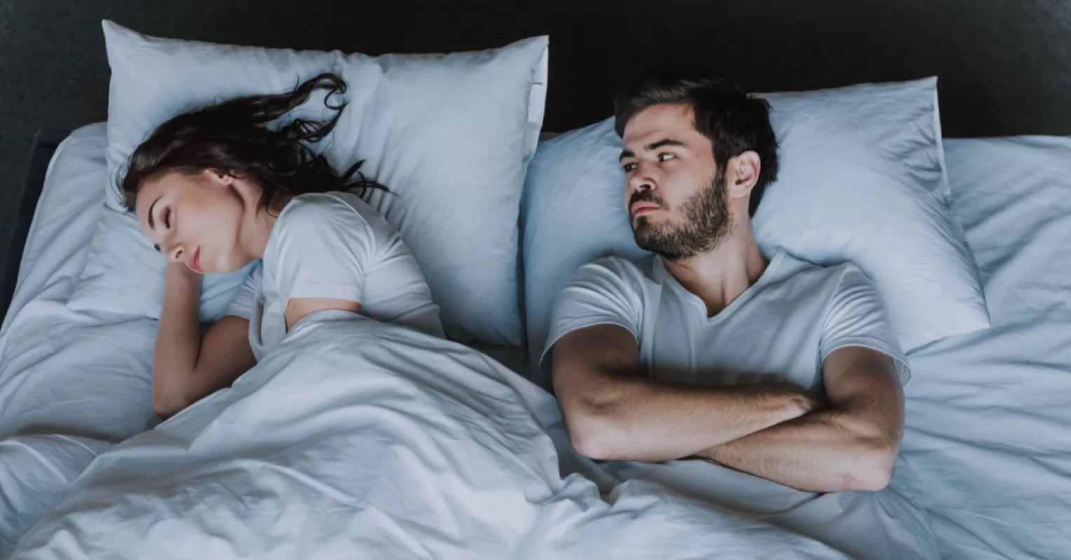 Woman and man in the bedroom