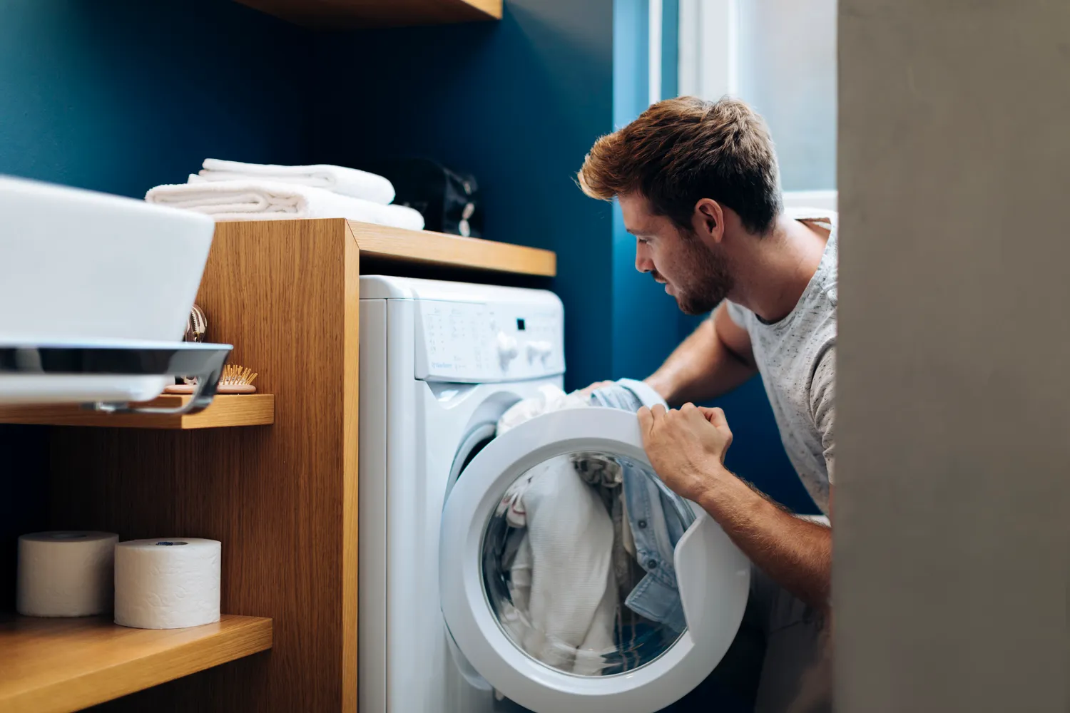 Man Clean Clothes Near Washing Machine