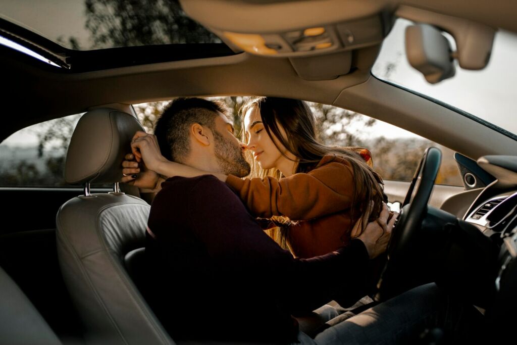 couple being romantic in car